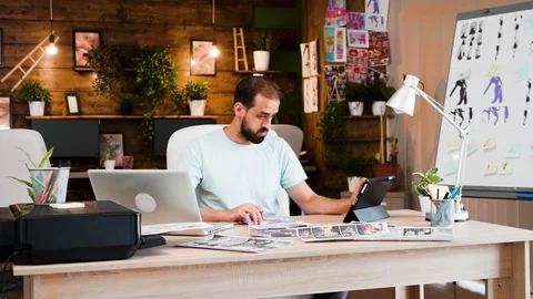 Handsome beard young creativ director working on his project in the office Stock Footage 113870817