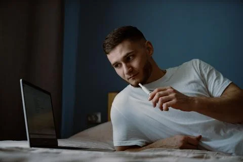 Handsome bearded guy working out at home Stock Photos