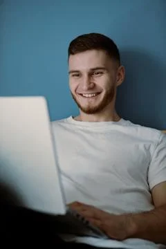 Handsome bearded guy working out at home Stock Photos
