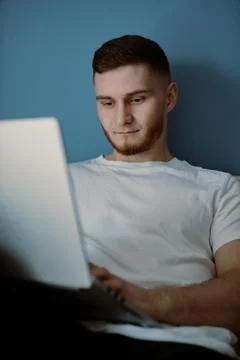 Handsome bearded guy working out at home Stock Photos