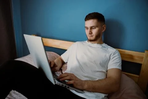 Handsome bearded guy working out at home Stock Photos
