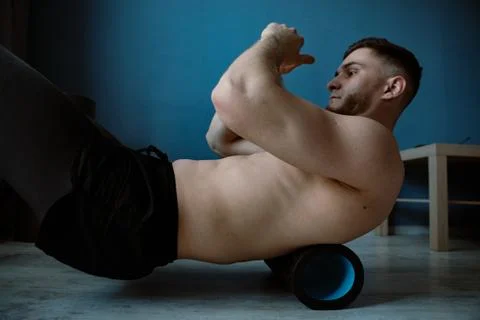 Handsome bearded guy working out at home Stock Photos
