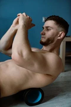 Handsome bearded guy working out at home Stock Photos