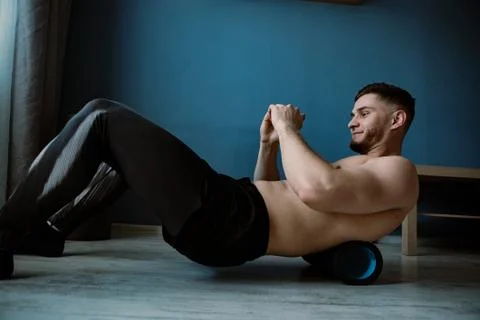 Handsome bearded guy working out at home Stock Photos
