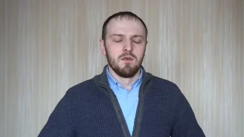 Handsome bearded man coughing by the wall Stock Footage 103120875