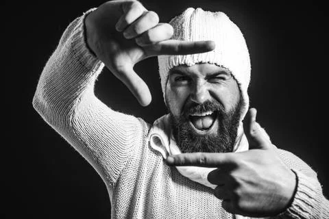 Handsome bearded man creating frame with fingers. Imaginary selfie photo. P.. Stock Photos