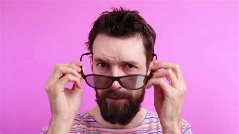 Handsome bearded man hipster put on sunglasses portrait on pink background Stock Footage 129503076