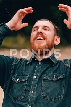 Handsome bearded man straightens your hair Stock Photos