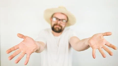 Handsome bearded man straw hat  glasses smiling, hand gesture no Stock Photos