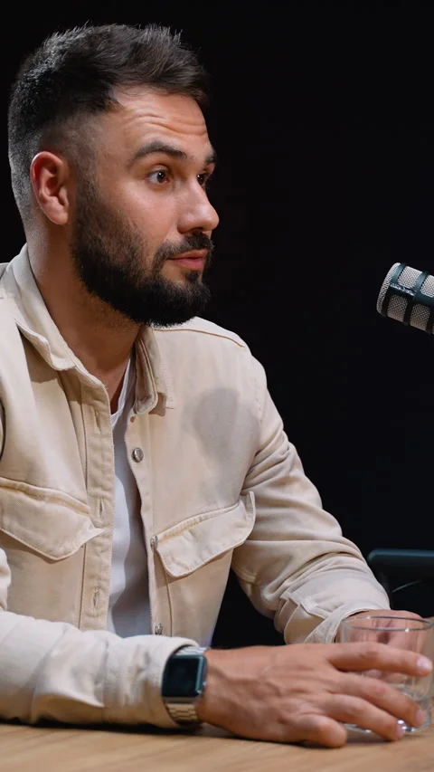 Handsome bearded man talking during podcast interview Stock Footage 318194585