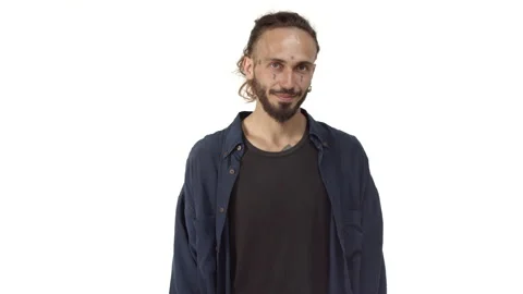 Handsome bearded man with tattoos on face and body, avoiding eye contact and Stock Footage 141740200
