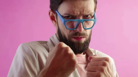 Handsome bearded man throwing punches boxing at the camera Stock Footage 122560975