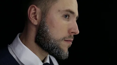 Handsome bearded man with trendy beard posing for photographer. Close up. Stock Footage 75228584