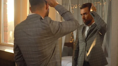 Handsome bearded man is using atomizer nozzle with perfume Stock-Footage 116335269