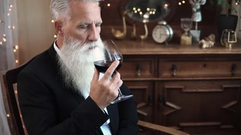Handsome bearded senior man drinking red wine Stock Footage 233629678