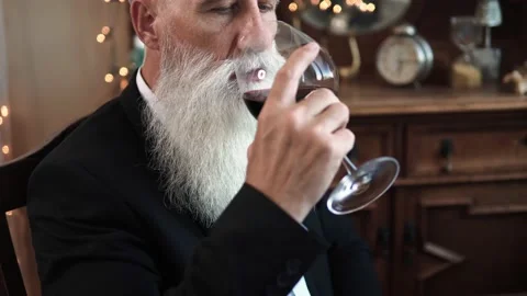 Handsome bearded senior man drinking red wine Stock-Footage 233630274
