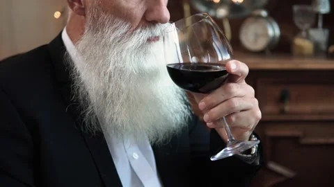 Handsome bearded senior man drinking red wine Stock-Footage 233630451