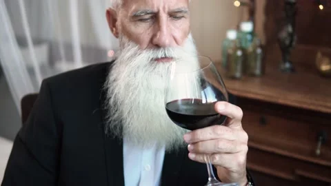 Handsome bearded senior man drinking red wine Stock-Footage 233630810