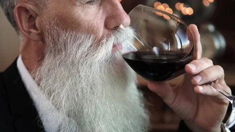 Handsome bearded senior man drinking red wine Stock-Footage 233631006