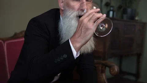Handsome bearded senior man drinking red wine Stock-Footage 233631942
