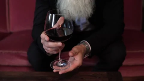 Handsome bearded senior man drinking red wine Stock Footage 233654889