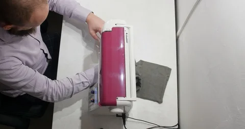 Handsome bearded tailor making clothes using a sewing machine. Life changing Stock Footage 120073597