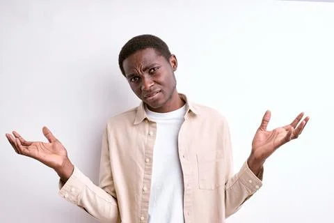 Handsome black man clueless and confused expression with arms and hands raised Stock Photos