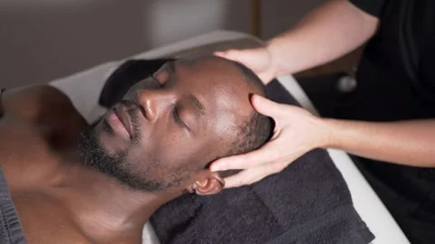 Handsome black man getting his scalp massaged Stock Footage 225038420