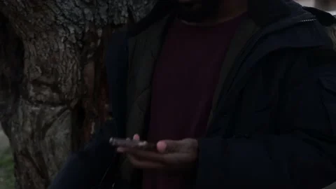 Handsome Black Man Making a Phone Call on Smartphone in Neighborhood Stock Footage 146162960