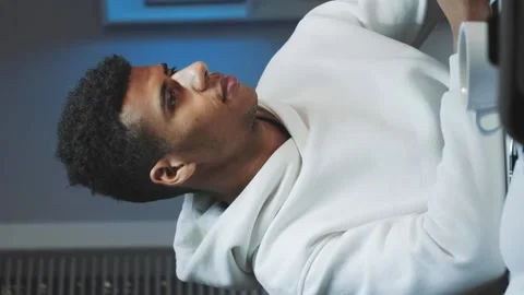 Handsome black man smiling to the camera while working home Stock Footage 131531467