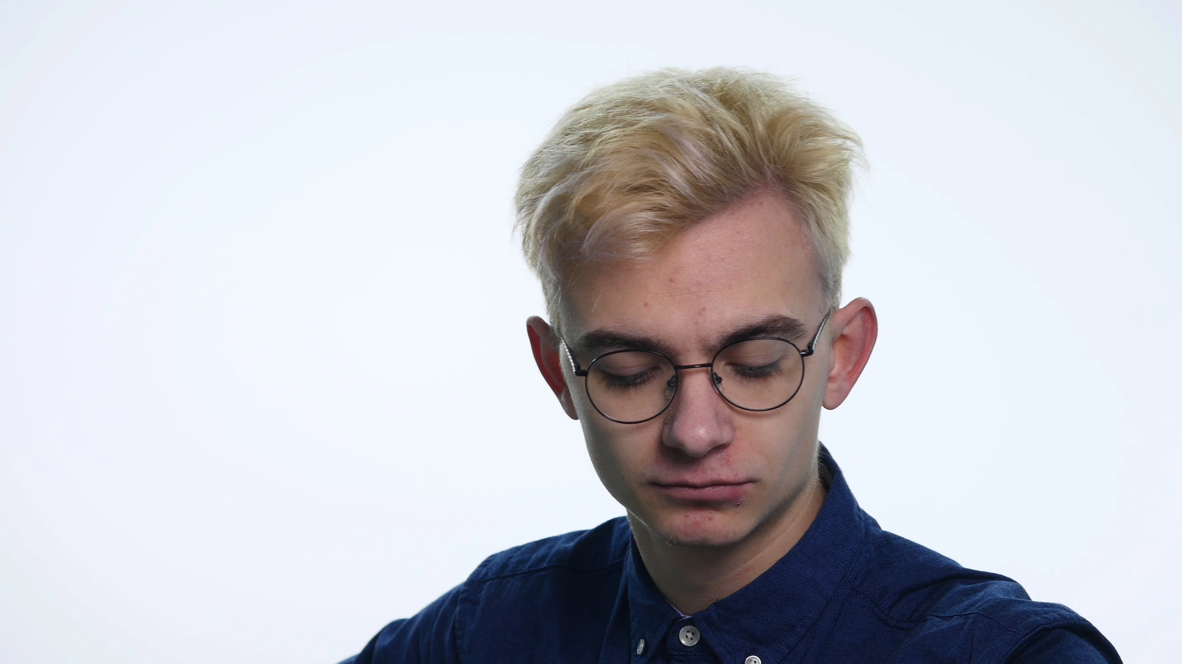 Handsome blond man showing different emotions on white background. Close up