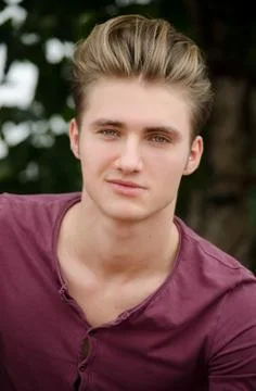 Handsome blond young man head-shot outside Stock Photos