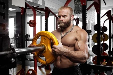 Handsome bodybuilder guy prepare to do exercises with barbell Foto stock