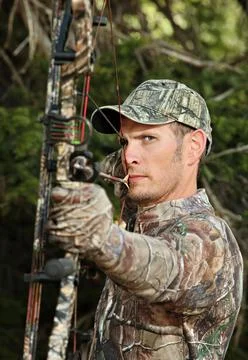 Handsome bow hunter close up Stock Photos