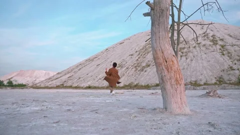 Handsome boy dance, background white mountain and blue sky Stock Footage 138865300