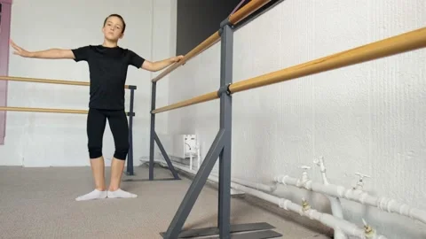 Handsome boy dancer performing a third pose. Ballet dance training for children. Stock Footage 138553514