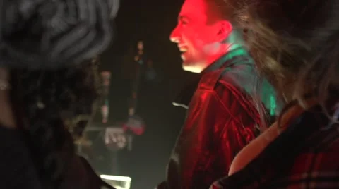 Handsome boy having drinks at bar counter in night club Stock-Footage 50662677