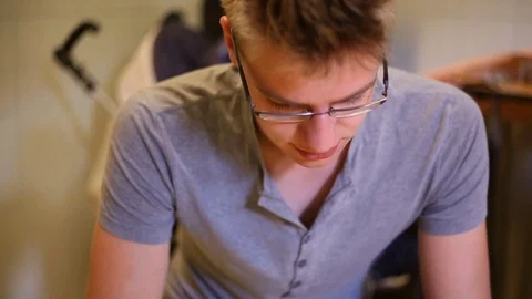 Handsome boy smiling to the camera and telling something Stock Footage 78672546