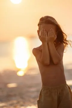 Handsome boy at sunset Stock Photos