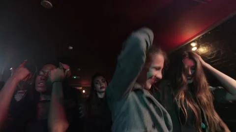 Handsome boy taking photograph while dancing in night club 動画素材 50660021