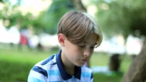 Handsome brother and sister using tablet in summer green park. Kids use laptop 스톡 동영상 137859014