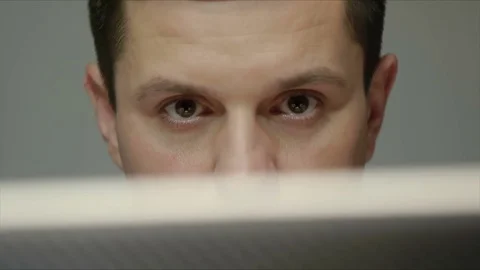 Handsome brunet man close up typing on laptop computer at desk Stock Footage 70633504