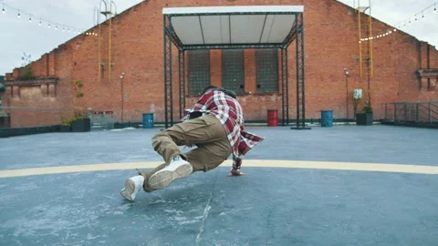 Handsome brunette dancer demonstrating basic dance positions training on the Stock Footage 138237139