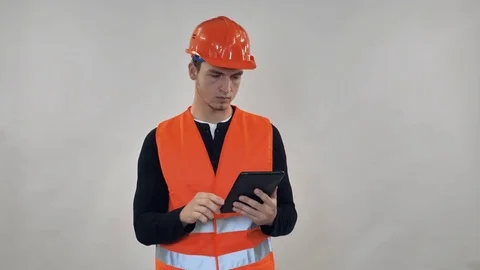 Handsome builder posing in studio Stock Footage 81802296