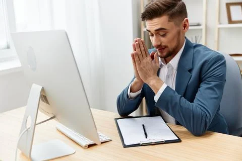 Handsome businessman computer desktop work self-confidence paper folder Stock Photos