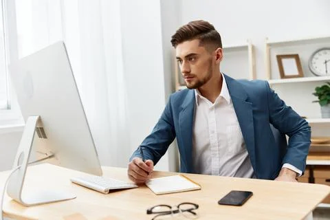 Handsome businessman computer desktop work self-confidence paper folder isolated Stock Photos
