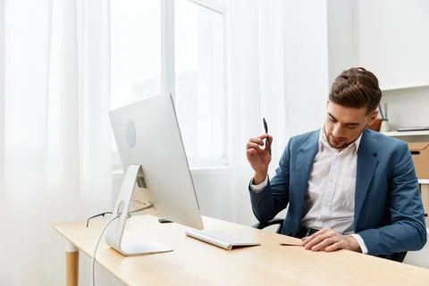 Handsome businessman computer desktop work self-confidence technologies Stock Photos