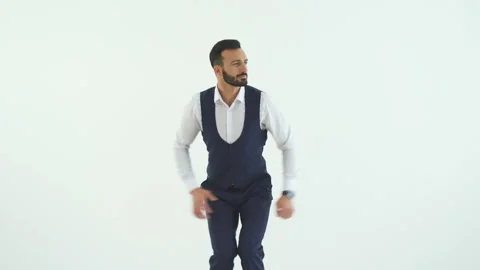 The handsome businessman dancing on the white background Video stock 100748347