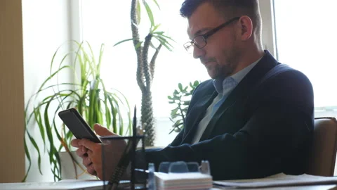 Handsome businessman developing a business project and analyzing statistic Stock Footage 135020648