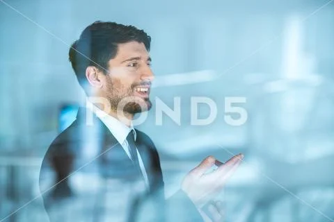 The handsome businessman gesture over the window Stock Photos